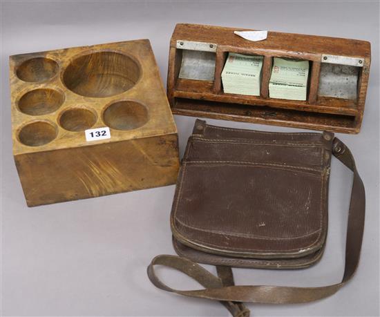 A wooden money scoop, a ticket and money tray and leather bus mans bag